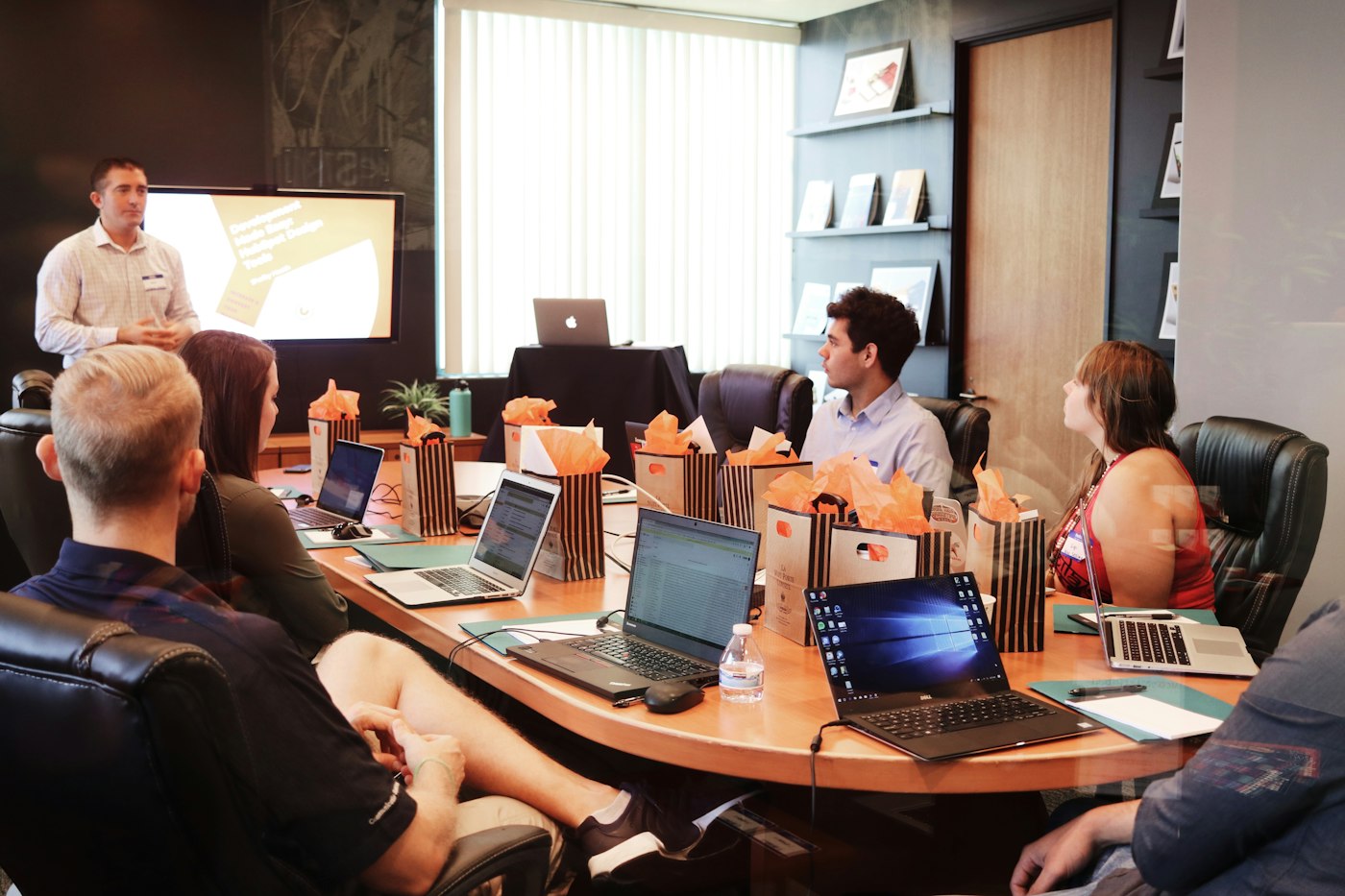 A presentation in a glass-walled room